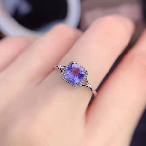 Detail of square lavender crystal ring in silver with pavé-set stones on the band