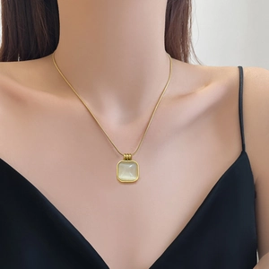 Minimalist titanium steel necklace with square cat-eye stone pendant on model