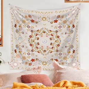Cozy home decor featuring a bohemian mandala tapestry with sun and moon celestial motifs