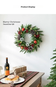 Detailed view of 40cm Christmas wreath with pine cones, red berries and warm LED lights