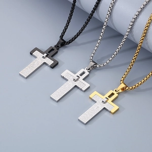 Detailed close-up of double-layer cross necklaces in black, silver, and gold steel
