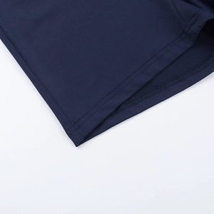 Detailed close-up of navy blue tank top with high-density fabric and double-needle stitching