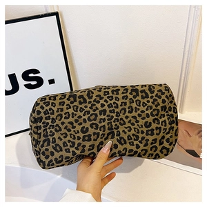 Detail of a cylindrical leopard print tote bag with high-density canvas texture and pattern