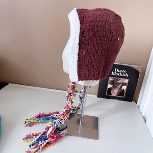 Ethnic style burgundy plush earmuff hat with colorful tassels and soft white faux fur lining