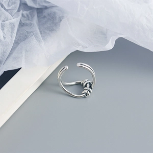 Macro shot of silver S925 sterling silver ring with twisted wire design detail
