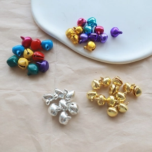 Close-up of vibrant multicolored aluminum bells in gold silver and assorted bright tones