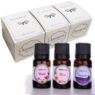 Three 10ml essential oil bottles in violet, rose and lavender with white gift boxes