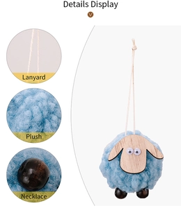 Detail view of a blue felt sheep ornament with wooden face and plush body texture