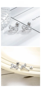Macro detail of silver bow infinity stud earring with cubic zirconia and flat screw back