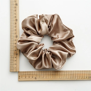 Detailed measurement of large champagne satin scrunchie showing 15cm diameter size