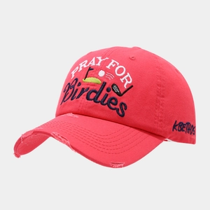 Detail of red distressed baseball cap with PRAY FOR Birdies embroidery and side logo