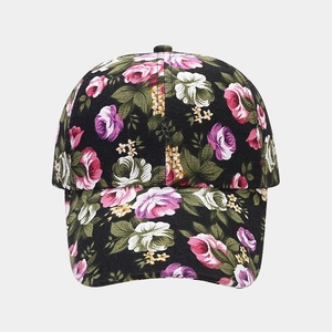 Detailed close-up of retro floral canvas baseball cap with pink and purple rose prints