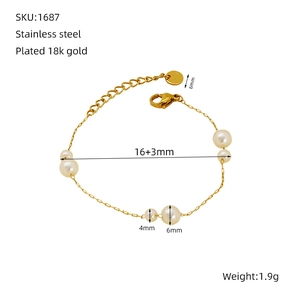 Detail of 18k gold plated stainless steel pearl bracelet showing lobster clasp and chain