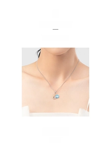 Detail of s925 silver necklace with blue enamel evil eye pendant and sparkling crystals