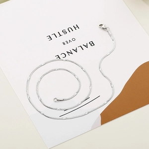 Detailed view of the 1.5mm flat snake chain necklace with polished silver finish