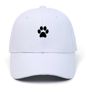 Close-up of black cartoon cat paw embroidery on high-quality white cotton baseball cap