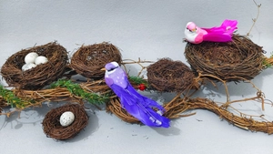 Artificial bird nest set with speckled eggs and colorful birds for Easter decoration