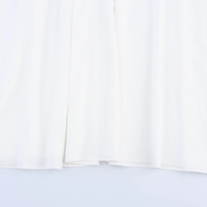 Vacation style white backless sundress featuring a soft flowing fabric and crochet neckline