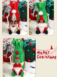 Three festive Christmas wine bottle covers with gnome and reindeer designs on velvet fabric