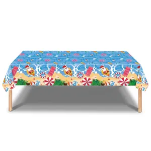 Summer Christmas tablecloth featuring Santa on a beach with palm leaves and pool elements