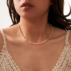 Pink opal and irregular pearl S925 silver necklace worn on model neck for elegant look