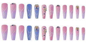 Detailed macro view of long coffin press on nails with pink purple gradient and rhinestones