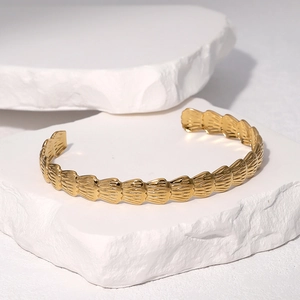 Minimalist 18k gold plated stainless steel cuff bracelet with feather textured engraving
