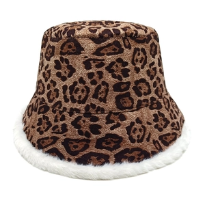 Detailed view of leopard print bucket hat featuring soft white faux fur trim and plush texture