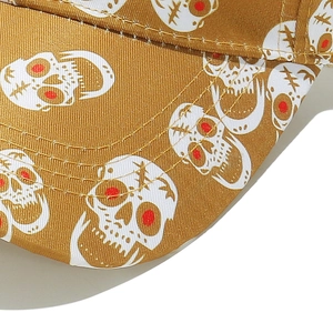 Close-up of mustard yellow canvas brim with skull embroidery and precision stitching