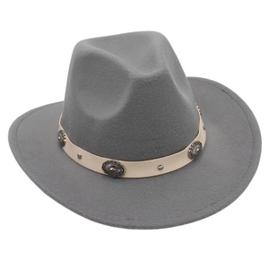 Close-up of gray felt cowboy hat with white leather band and embossed silver rivets