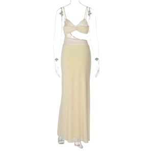 Detailed close-up of beige two-piece maxi dress with waist cutout and twisted bodice design