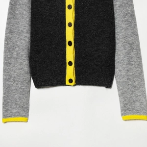 Three-color contrast knit cardigan with charcoal grey, light grey and yellow accents