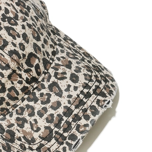 Detail shot of distressed leopard print baseball cap with frayed edges and sewing lines