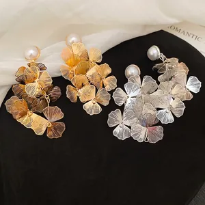 Elegant hollow flower tassel earrings with pearls in gold and silver finish set