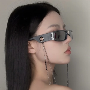 Close-up of vintage dark gray rectangle sunglasses with detachable silver metal chain