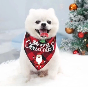 Christmas dog bandana with red black plaid and Santa print on white Pomeranian