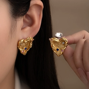 Textured gold heart stud earrings with colorful zircon stones in a minimalist design