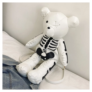 Detail of white leather teddy bear backpack with black gothic skeleton bone print