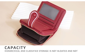 Detail view of red leather accordion wallet featuring multi-card slots and photo window