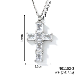 Detailed view of silver cross pendant with size specs and five large inlaid zircons