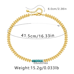 Detailweergave van gouden bladketting met turquoise kralen inclusief afmetingen