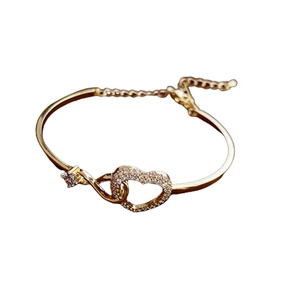 Elegant gold heart bracelet with zircon stones and hollow geometric design for women