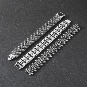 Detailed view of punk skull bracelets with intricate engravings and metallic luster