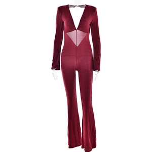 Detail view of red long sleeve bodysuit with deep V-neck and cut-out waist design