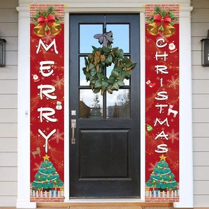 Close-up of red Merry Christmas door banners with Santa Claus and reindeer on a black door