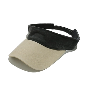 Detailed view of the vintage washed fabric and two-tone color on this sun visor hat.