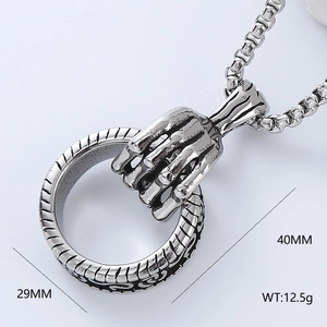 Polished stainless steel skeleton hand holding ring pendant, 40mm height and 29mm width