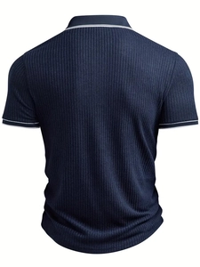 Detail view of the navy blue ribbed polo shirt showing stripe collar and knit texture