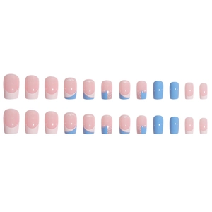Pink and blue French press-on nails set with heart designs and glitter accents