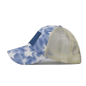 Detail of blue gradient star pattern and breathable mesh on a vintage baseball cap